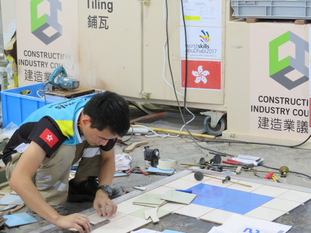 Mr YIP Kim-fai competes in “Wall and Floor Tiling”.