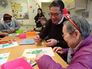 SDEV, Mr Michael WONG making a loving Christmas card with a granny.