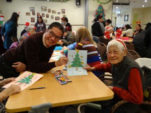 SDEV, Mr Michael WONG making a loving Christmas card with a granny.
