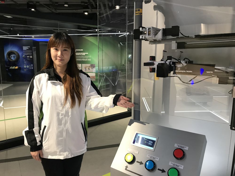 The officer of the CITAC, Ms Chammy WAN, says the “Service Robot for Repair of Exterior Gas Pipe” allows workers to repair the exterior walls of buildings, including polishing and painting, with remote control.