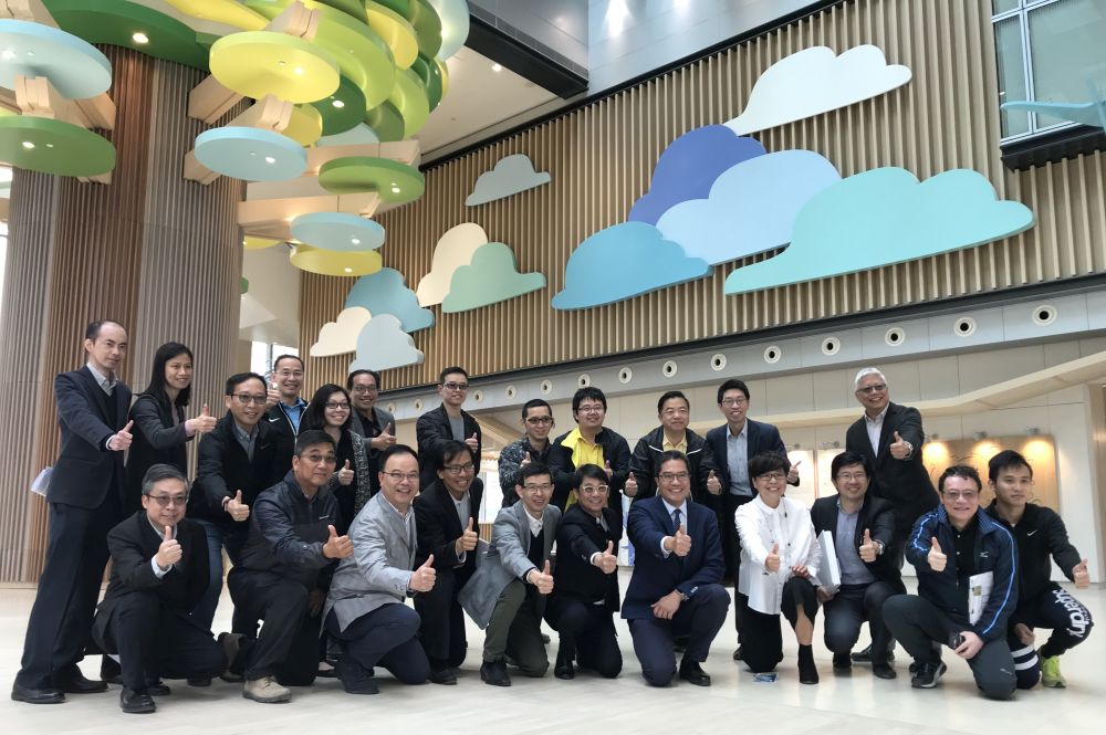 SDEV, Mr Michael WONG (fifth right, front row); Director of Architectural Services, Mrs Sylvia LAM (fourth right, front row); and the ArchSD team pose for a group photo in the lobby of the HKCH.
