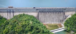 Pictured is the Tai Tam Tuk Reservoir Dam and people can travel by vehicle through the carriageway over the dam.