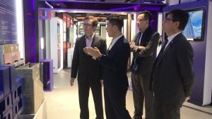 The USDEV, Mr LIU Chun-san (first left), and the PA, Mr Allen FUNG (second right), are briefed by the manager of the CITAC, Mr WAN Kai-hong (second left), on the benefits of the technology of Modular Integrated Construction (MiC).