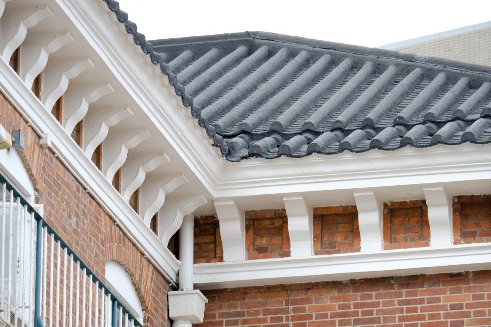 Both buildings were built in Western style and blended with Chinese features, such as the pitched and double-tiled Chinese roofs and the very typical cornices.