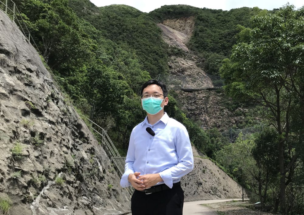 Geotechnical Engineer of the Civil Engineering and Development Department (CEDD), Mr Wai Cheuk-ting, visits Sai Wan Road in Sai Kung, where a massive landslide has occurred before, and speaks to us about how the Landslip Investigation Section of the Geotechnical Engineering Office (GEO) looks into causes of landslides.