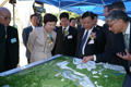 Mrs Lam (second left) and Mr Lu (second right) are briefed on Stage IV of the Shenzhen River Regulation Project. 