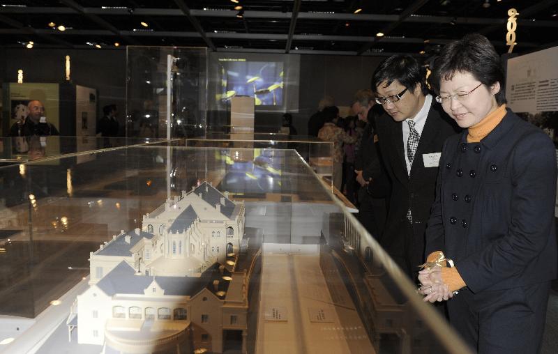 Mrs Carrie Lam, views a model of Bethanie in the 'Heritage Alive: UNESCO Culture Heritage Awards' Exhibition. Accompanying Mrs Lam is the Commissioner for Heritage, Mr Jack Chan.