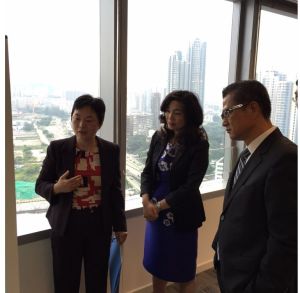 Ms YING Fun-fong, Head of Kai Tak Office of the Civil Engineering and Development Department, briefs me and the Director-General of Trade and Industry, Ms Salina Yan Mei-mei, on the latest progress of the Kai Tak Development (KTD).