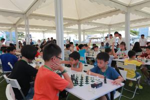 Hundreds of primary school students play chess at the Central Harbourfront Event Space.