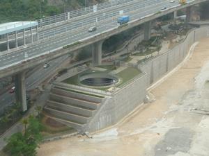 The stilling basin of the Lai Chi Kok Drainage Tunnel was constructed under the viaduct of the Tsing Sha Highway while a pet garden was built above it.