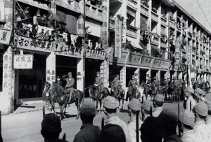 On December 28, 1941, the Japanese troops marched along Hennessy Road in Wan Chai after capturing Hong Kong.
