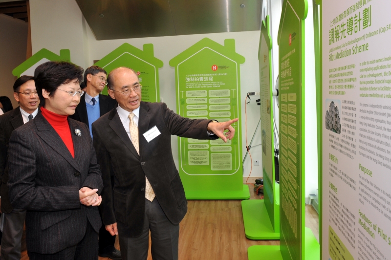 Mrs Lam tours the exhibition of the Pilot Mediation Scheme and the Pilot Scheme on Outreach Support Service for Elderly Owners.