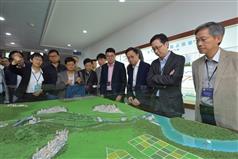 The Secretary for Development, Mr Eric Ma (second right), joins a duty visit to the Dongjiang River Basin by Legislative Council (LegCo) members today (April 15). Picture shows Mr Ma; the Permanent Secretary for Development (Works), Mr Hon Chi-keung (first right), and the  LegCo members viewing a model at the Taiyuan Pumping Station in Dongguan to learn about the Dongshen Water Supply Scheme.