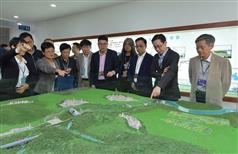 The Secretary for Development, Mr Eric Ma (second right), joins a duty visit to the Dongjiang River Basin by Legislative Council (LegCo) members today (April 15). Picture shows Mr Ma; the Permanent Secretary for Development (Works), Mr Hon Chi-keung (first right), and the  LegCo members viewing a model at the Taiyuan Pumping Station in Dongguan to learn about the Dongshen Water Supply Scheme.