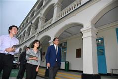 The Secretary for Development, Mr Michael Wong, visited Eastern District today (May 3). Photo shows Mr Wong (first right) visiting the historic building (Block 10) in Lei Yue Mun Park and Holiday Village. Looking on are the Executive Secretary (Antiquities & Monuments) of Antiquities and Monuments Office, Ms Susanna Siu (centre), and Curator (Historical Buildings), Mr Ng Chi-wo (first left).