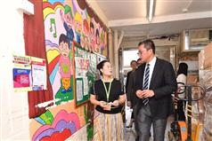 The Secretary for Development, Mr Michael Wong, visited the Hong Kong Down Syndrome Association Tiptop Training Centre during his visit to Sha Tin District today (August 24). Photo shows the person-in-charge of the centre briefing Mr Wong (right) on the facilities of the sheltered workshop.