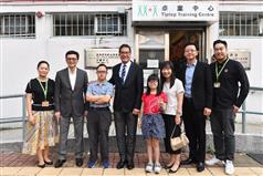 The Secretary for Development, Mr Michael Wong, visited the Hong Kong Down Syndrome Association Tiptop Training Centre during his visit to Sha Tin District today (August 24). Mr Wong (fourth left) and the Under Secretary for Development, Mr Liu Chun-san (second left), are pictured with the person-in-charge and trainees of the centre.