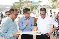 The Secretary for Development, Mr Michael Wong, visited Sai Kung District today (September 28). Photo shows Mr Wong (right) being briefed by the Deputy Project Manager (East) of the Civil Engineering and Development Department, Mr Michael Leung (centre), on the short-term enhancement works being carried out along the waterfront promenade. Looking on is the Chairman of the Sai Kung District Council, Mr George Ng (left).
