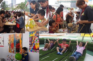 Parents and children make handcrafts together at a carnival