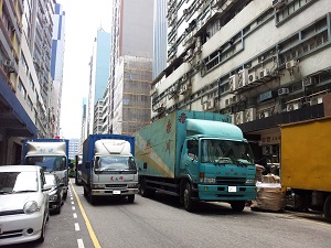 The loading and unloading of trucks is commonplace during the transformation of Kowloon East. 