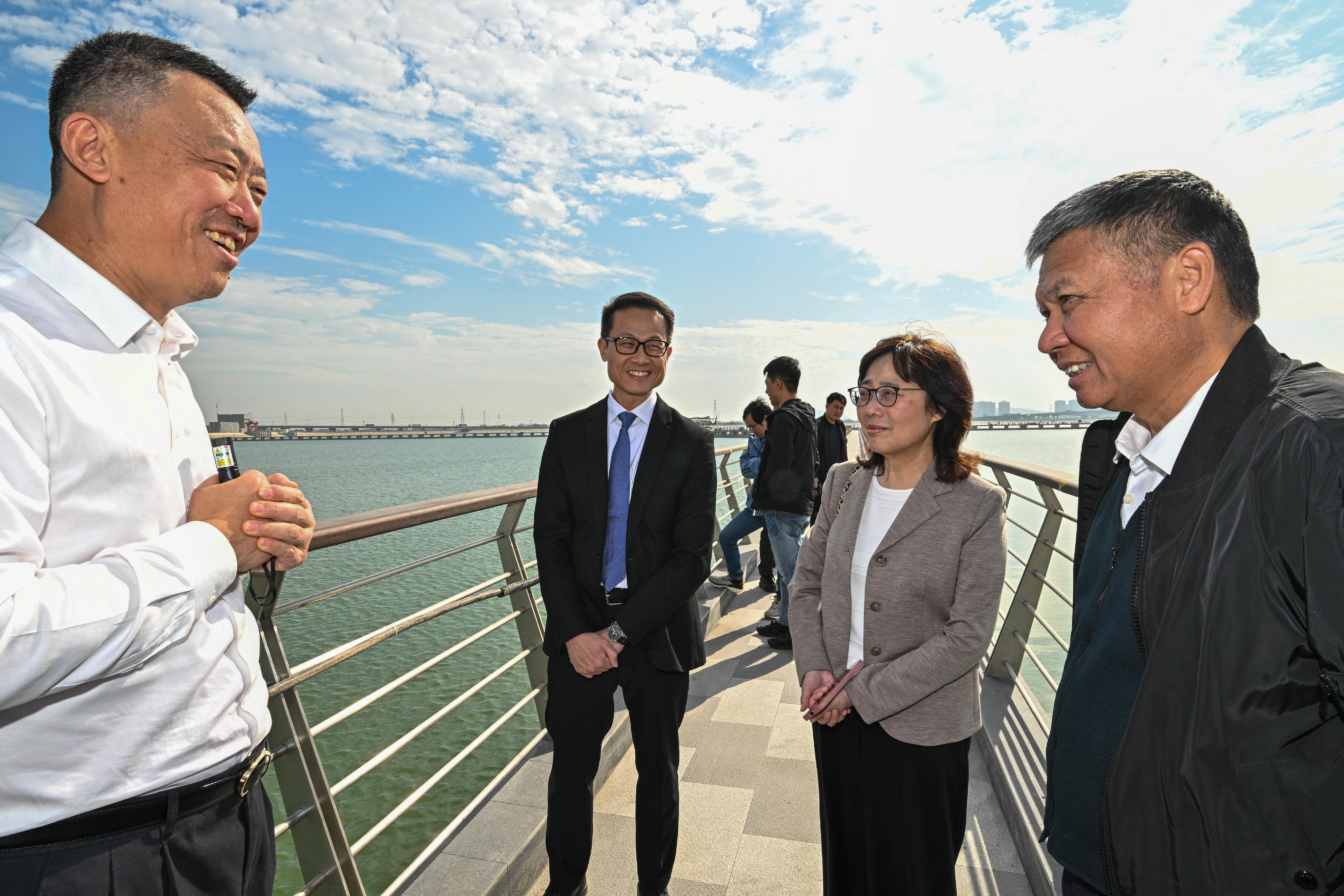 The Secretary for Development, Ms Bernadette Linn, signed a new agreement on the supply of Dongjiang water to Hong Kong from 2024 to 2026 with the Director General of the Water Resources Department of Guangdong Province, Mr Wang Lixin, in Guangzhou today (December 27). Photo shows Ms Linn (second right) visiting Gaoxinsha Pumping Station in Nansha, Guangzhou, to see the Water Resources Allocation Project in the Pearl River Delta Area and receiving a briefing from a project representative after the signing ceremony. Beside her are Mr Wang (first right) and the Director of Water Supplies, Mr Tony Yau (third right).