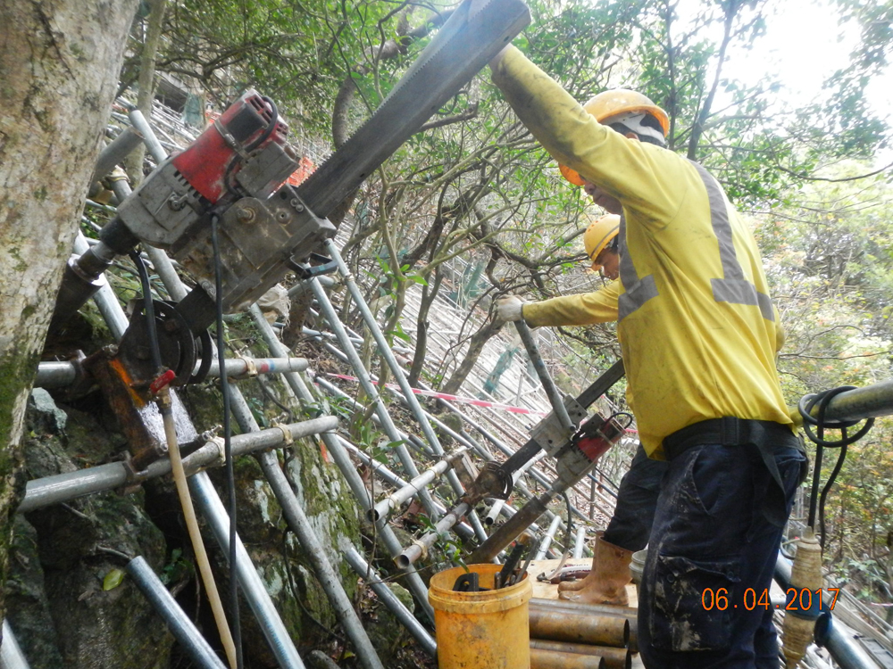Workers busy with the slope stabilisation works
