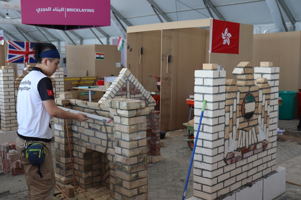 Hong Kong Team member Mr YAU Ho-him competes in “Bricklaying”.