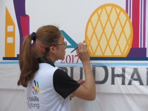 Hong Kong Team member Ms WONG Mei-sze competes in “Painting and Decorating”.