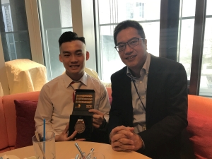 SDEV, Mr Michael WONG (right), congratulates Mr CHAN Siu-lam on winning a Medallion for Excellence in “Electrical Installations”.