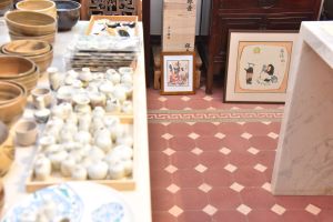 The original wooden double doors that lead to the balcony and the original floor tiles have been preserved.