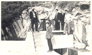 Mr Jaswant SINGH (first left, back row) inspects the pipes and valves with his colleagues while working previously in the WSD.
