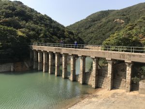 The Tai Tam Group of Reservoirs comprises the Tai Tam Upper Reservoir, Tai Tam Byewash Reservoir, Tai Tam Intermediate Reservoir and Tai Tam Tuk Reservoir.  Pictured is the Tai Tam Upper Reservoir Masonry Aqueduct, one of the 21 historic waterworks structures which have been declared monuments.