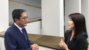 The Executive Director of Wharf Estates Limited, Ms LENG Yen-thean (right), introduces to the Secretary for Development, Mr WONG Wai-lun, Michael, about the idea and features of the Murray Building revitalisation project.
