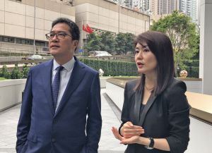 The Executive Director of Wharf Estates Limited, Ms LENG Yen-thean (right), introduces to the Secretary for Development, Mr WONG Wai-lun, Michael, about the idea and features of the Murray Building revitalisation project.