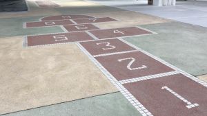 The first floor of the market was originally an indoor playground with a table for table tennis.  After revitalisation, the hopscotch will be preserved.