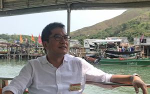 The Tai O Dragon Boat Water Parade was inscribed onto the Third National List of Intangible Cultural Heritage in 2011.  Pictured is Mr Michael WONG sitting in a pleasure boat to view the parade up close.