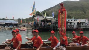 During the parade ritual, dragon boats tow deity statues on sacred sampans to parade through the watercourses between stilted houses in Tai O.