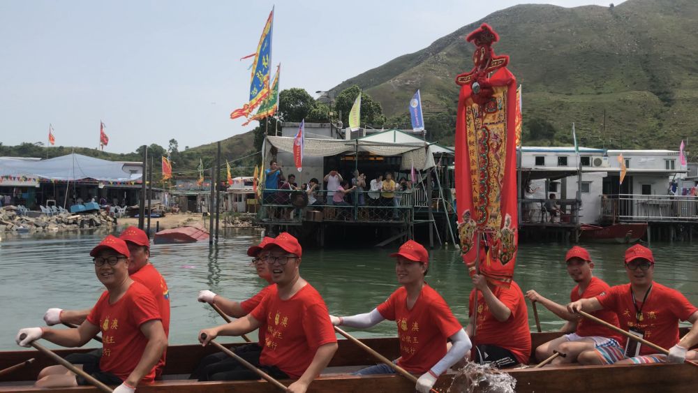 During the parade ritual, dragon boats tow deity statues on sacred sampans to parade through the watercourses between stilted houses in Tai O.