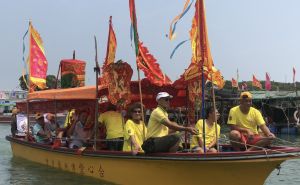 During the parade ritual, dragon boats tow deity statues on sacred sampans to parade through the watercourses between stilted houses in Tai O.