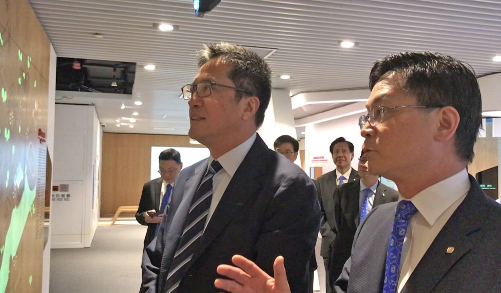 The SDEV, Mr Michael WONG (left), views the exhibits in the EMSD Gallery to learn more about the history and services of the EMSD.