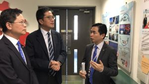 The Secretary for Development (SDEV), Mr WONG Wai-lun, Michael (centre), and the Director of Electrical and Mechanical Services, Mr SIT Wing-hang, Alfred (left), visit the Training Workshop provided under the Technician Training Scheme of the Electrical and Mechanical Services Department (EMSD).  Senior Engineer of the EMSD, Mr KWAN Kar-mun, Andy (right), illustrates the details of the training scheme.