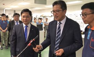 The EMSD provides advanced learning equipment to help enhance the professional and vocational skills of trainees.  Pictured is a trainee showing the SDEV, Mr Michael WONG (centre), how to use a welding simulator.