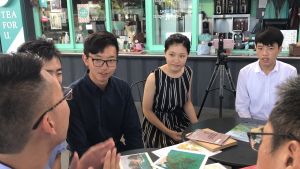 The two student participants (first and second right) of the “Be a Government Official for a Day” Programme listen carefully to the “big brothers” at the sharing session.