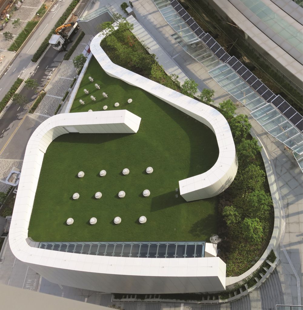 The community hall of the TI Tower utilises a number of environmental features, including the sun pipes (pictured here) to bring daylight into the interior.