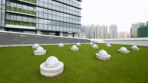 The community hall of the TI Tower utilises a number of environmental features, including the sun pipes (pictured here) to bring daylight into the interior.