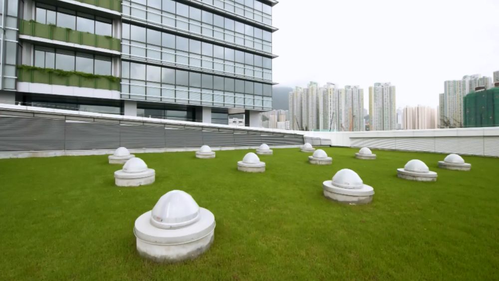 The community hall of the TI Tower utilises a number of environmental features, including the sun pipes (pictured here) to bring daylight into the interior.