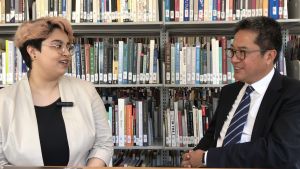 A student of SCAD Hong Kong, Ms Mynah Bhattacharyya (left), briefs the Secretary for Development (SDEV), Mr. WONG Wai-lun, Michael (right), on her team’s design package that won the design competition for the “Heritage Vogue · Hollywood Road” street carnival.