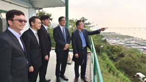 The Commissioner for Heritage, Mr José YAM (first right), says that the former police station is located at the top of a small hill in Lau Fau Shan, overlooking Ping Shan in the south-east and Deep Bay and Shenzhen in the north-west.