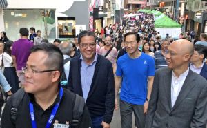The Acting Chief Secretary for Administration, Mr WONG Kam-sing (first right), the Convenor of the Non-official Members of the Executive Council, Mr Bernard Charnwut CHAN (second right) and the Secretary for Development (SDEV), Mr WONG Wai-lun, Michael (second left), take part in the “Heritage Vogue · Hollywood Road” street carnival to enjoy the festive atmosphere on the Hollywood Road.