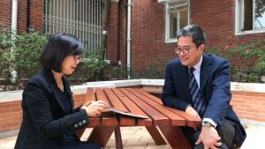 The SDEV, Mr Michael WONG (right), was briefed by the Executive Secretary of the AMO, Ms Susanna SIU (left), on the architectural features and histories of the May Hall, Eliot Hall and Fung Ping Shan Building.